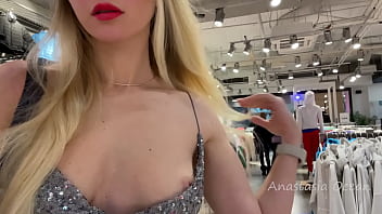 A marvelous doll in a enticing sundress exposes her bra-stuffers in a public shop